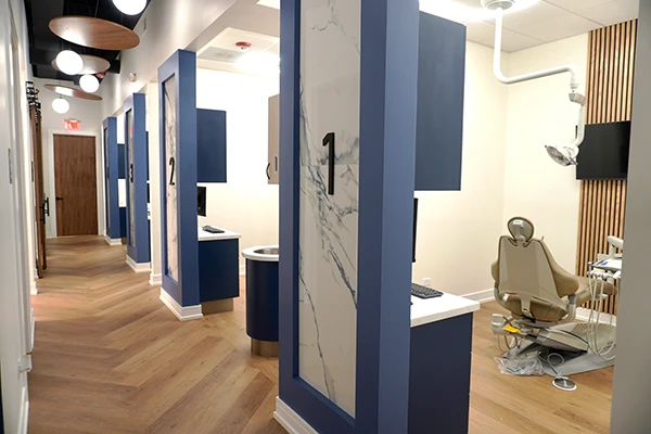 A hallway at Smile Circle Dental with treatment rooms visible