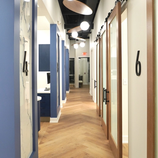 A hallway inside the clinic leading to treatment rooms