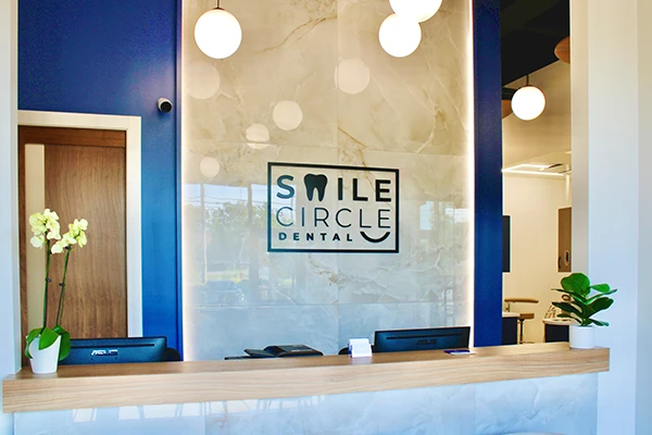 The sign behind the front desk at Smile Circle Dental