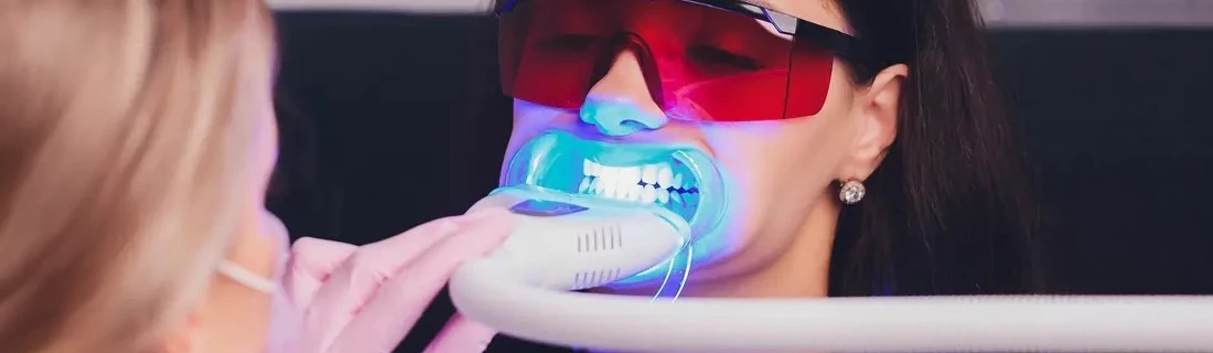 A patient receiving teeth whitening treatment